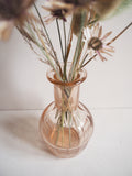 Vase en verre rose